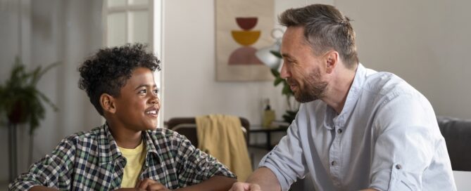 Dad talking to his son